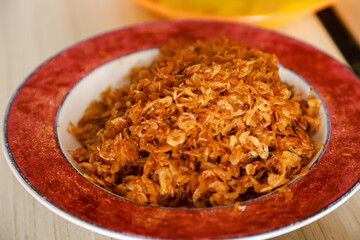 fried ebi (teri medan) or dried baby prawns served as a side dish on a plate