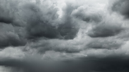 Obraz premium dark clouds make sky in black. Heavy rain thunderstorm . Pattern of clouds overcast predict tornado, Hurricane or thunderstorm and rainy.