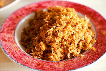 fried ebi (teri medan) or dried baby prawns served as a side dish on a plate