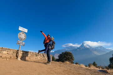 A young traveller trekking in Poon Hill view point in Ghorepani, Nepal