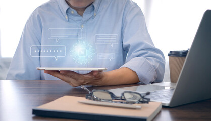 Businessman using technology smart robot AI, digital ai chatbot, on digital tablet. System artificial intelligence on virtual screen. .