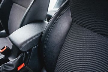 Modern black car interior, a black leather car seat , details interior. 