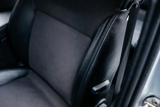 Modern black car interior, a black leather car seat , details interior. 