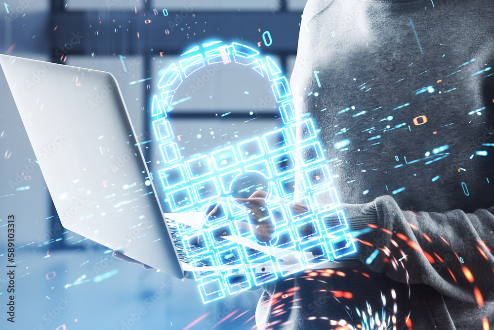 Poster close up of hacker hands using laptop with glowing safety padlock icon on blurry office interior bac