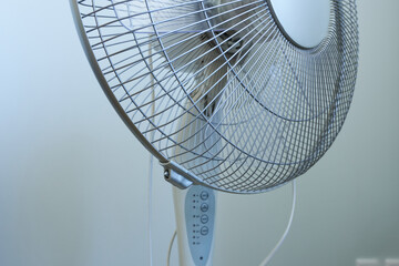 Close-up of a fan in a room.