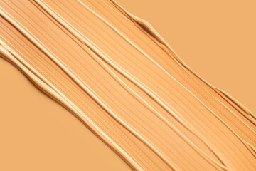 Texture of smudge cosmetic bb or cc cream foundation liquid background