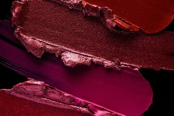 Red pink purple lipstick black background texture smudged - obrazy, fototapety, plakaty