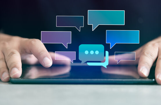 Tablet with chatting hologram speech bubbles. Speech bubbles for a chat. Text sms template bubbles. Text online conversation mockup. Messenger interface. Instant messaging app
