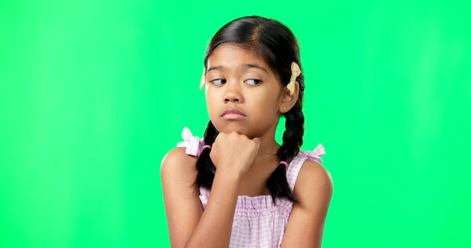 Eye roll and annoyed girl with a green screen in a studio feeling bored while thinking. Think, young child and casual emoji of a student waiting, tired and isolated with youth while frustrated
