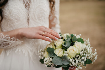 Hand in hand on a background of flowers