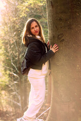 Fototapeta premium A woman on a walk in the autumn forest.