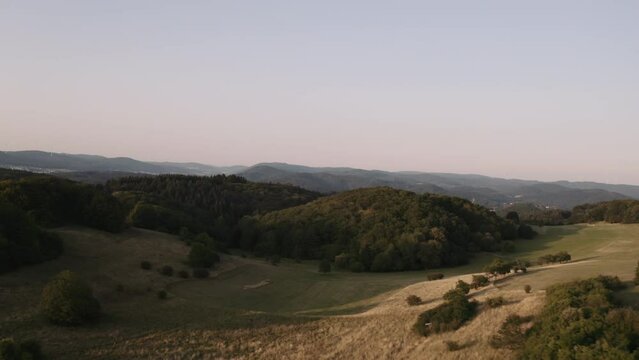 Aerial footage of German forest landscapes under a clear sky