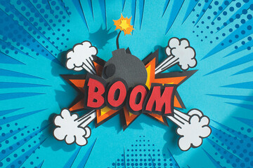 Handmade colorful paper cutting speech bubble with text boom. Pop art and comic style. Blue...