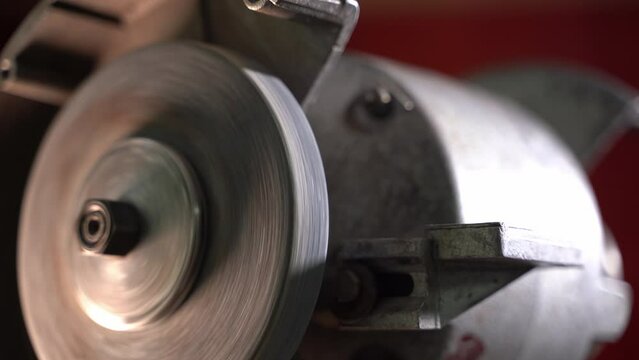 Checking the performance of the grinding machine. Trial run of abrasive wheel close up