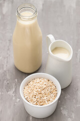 Oat milk. Healthy vegan non-dairy organic drink with flakes