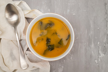Vegetable cream soup with spinach in bowl