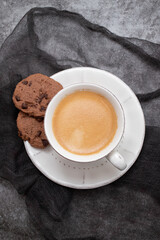 cup of coffee on ceraic on gray ceramic