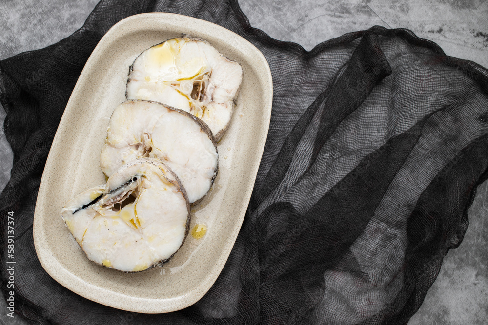 Wall mural boiled fresh fish with oil in dish