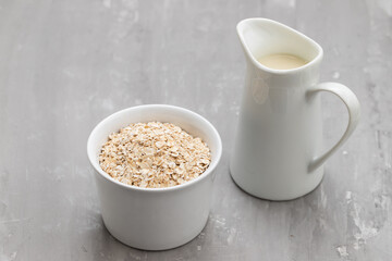 Oat milk. Healthy vegan non-dairy organic drink with flakes