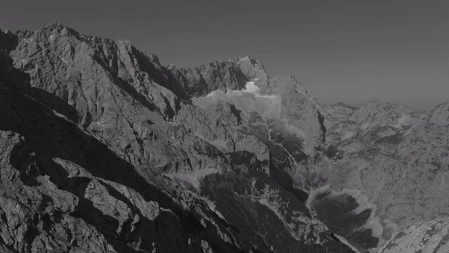 Grayscale slow motion aerial view of the mountains at Zugspitze in Germany