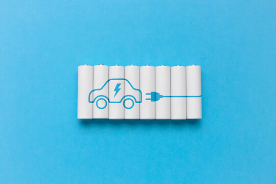 Set of electric car batteries on blue background