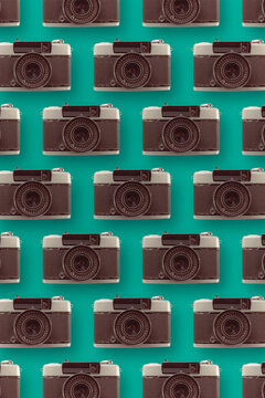 Various retro cameras on blue background