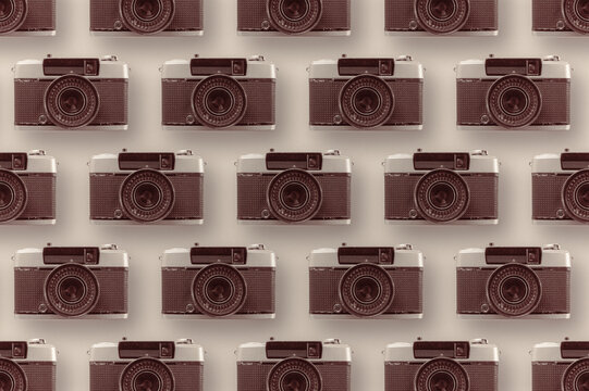 Various retro cameras on bright background