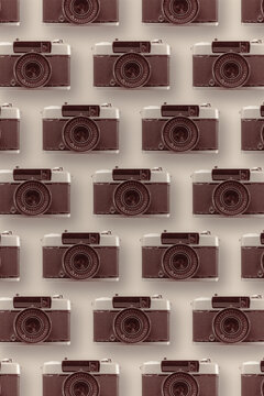 Various retro cameras on bright background