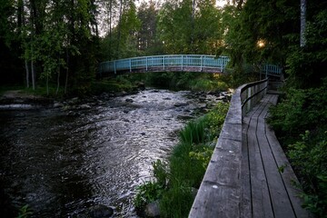 Fototapeta na wymiar Beautiful shot of a river flowing in a forest in Myllykoski, Finland