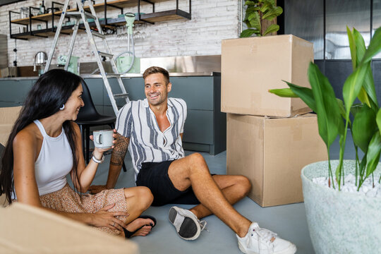 Happy couple taking break during relocation