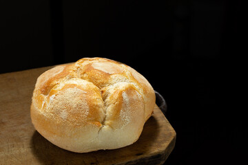 Freshly baked bread on rustic wooden table