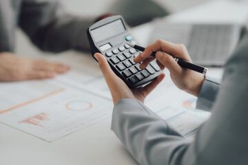 The financiers are calculating personal taxes for their customers.