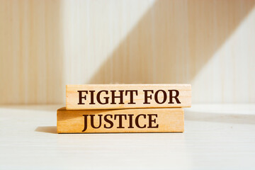 Wooden blocks with words 'FIGHT FOR JUSTICE'.