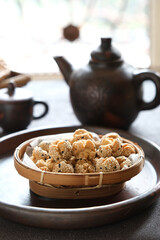 onde onde ketawa, Indonesian snack made from deep fried wheat flour mixing sticky rice flour and sesame seeds as topping. mini bite size