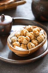 onde onde ketawa, Indonesian snack made from deep fried wheat flour mixing sticky rice flour and sesame seeds as topping. mini bite size