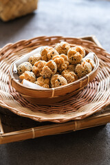 onde onde ketawa, Indonesian snack made from deep fried wheat flour mixing sticky rice flour and sesame seeds as topping. mini bite size