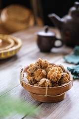 onde onde ketawa, Indonesian snack made from deep fried wheat flour mixing sticky rice flour and sesame seeds as topping. mini bite size