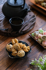 onde onde ketawa, Indonesian snack made from deep fried wheat flour mixing sticky rice flour and sesame seeds as topping. mini bite size