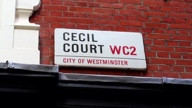 White street sign of Cecil Court at the City of Westminster borough in London