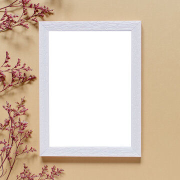 Blank greeting card, invitation and envelope mockup. Minimal floral frame made of dry flowers and branches. Flat lay, top view. Happy mother's day, birthday, wedding composition.