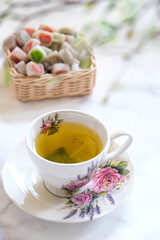 a cup of tea and dessert on the table