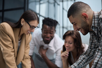 Fototapeta premium Ambitious smart employee speaks in a meeting and shares her opinion on a creative idea in a group briefing