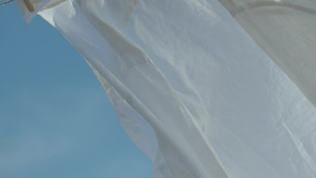 Crumpled shirt that takes the wind in slow motion