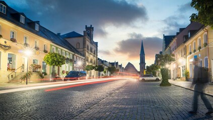 Long exposure of tail lights of a car in a city street