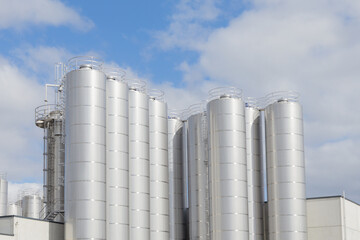A close up of Industrial silos for food milk production