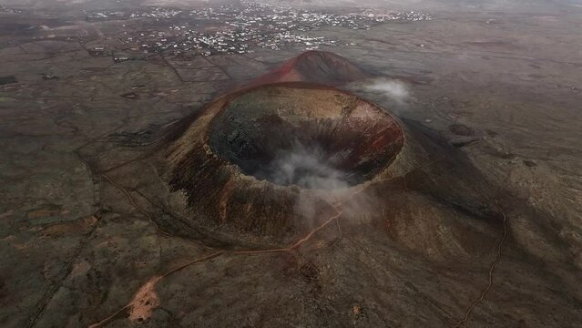 View from above, stunning aerial view of Calderon Hondo during a beautiful sunrise. Calderon Hondo is a volcanic caldera in the sland of Fuerteventura, Canary Islands.