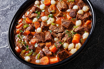 boneless beef short ribs stew in black bowl