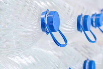 Water in plastic bottles on a white background