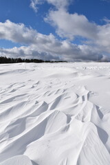 Fototapeta na wymiar The effect of wind on snow, Sainte-Apolline, Québec, Canada