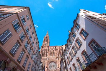 Amazing dome of Strasbourg Cathedral or Cathedrale Notre-Dame de Strasbourg against blue sky, during sunny summer day in France.